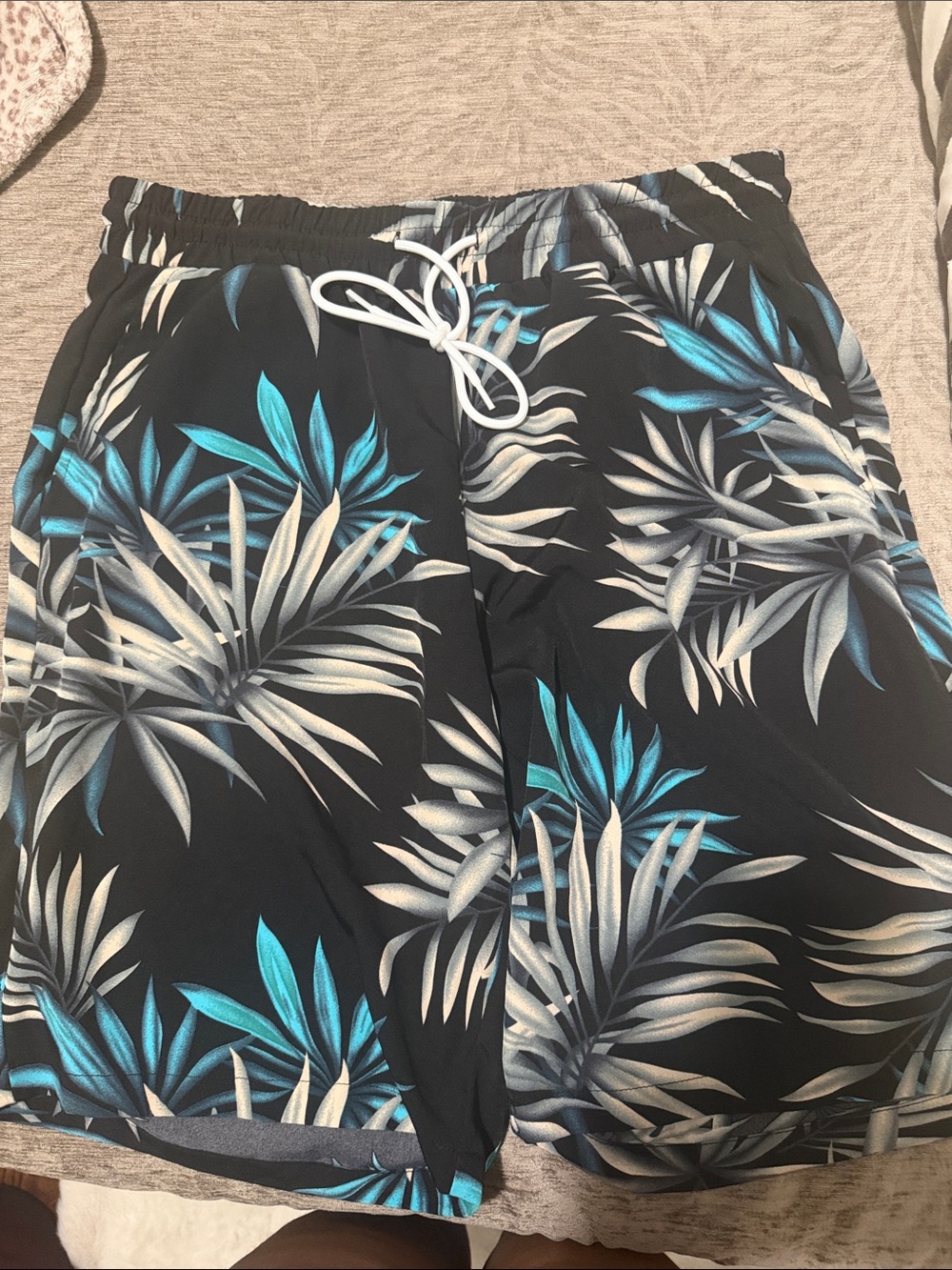 NFINITY Black Swim Shorts with Blue and Gray Tropical Leaves